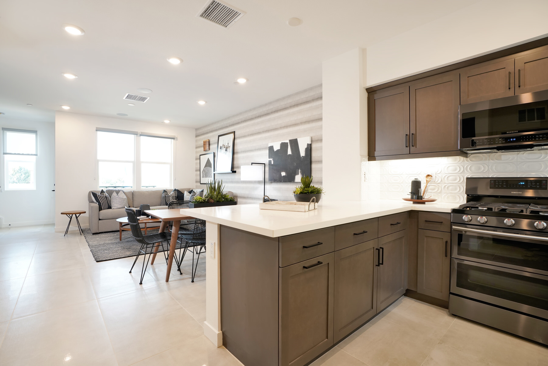 Kitchen/Dining/Living in Plan 1 at Townes at Magnolia by Melia Homes in Anaheim, CA