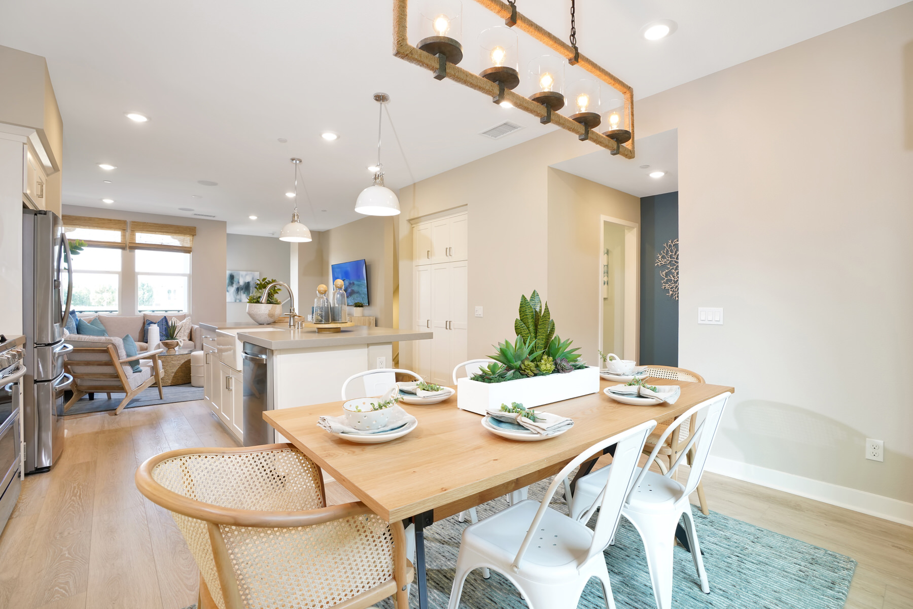 Dining/Kitchen/Living in Plan 2 at Townes at Magnolia by Melia Homes in Anaheim, CA