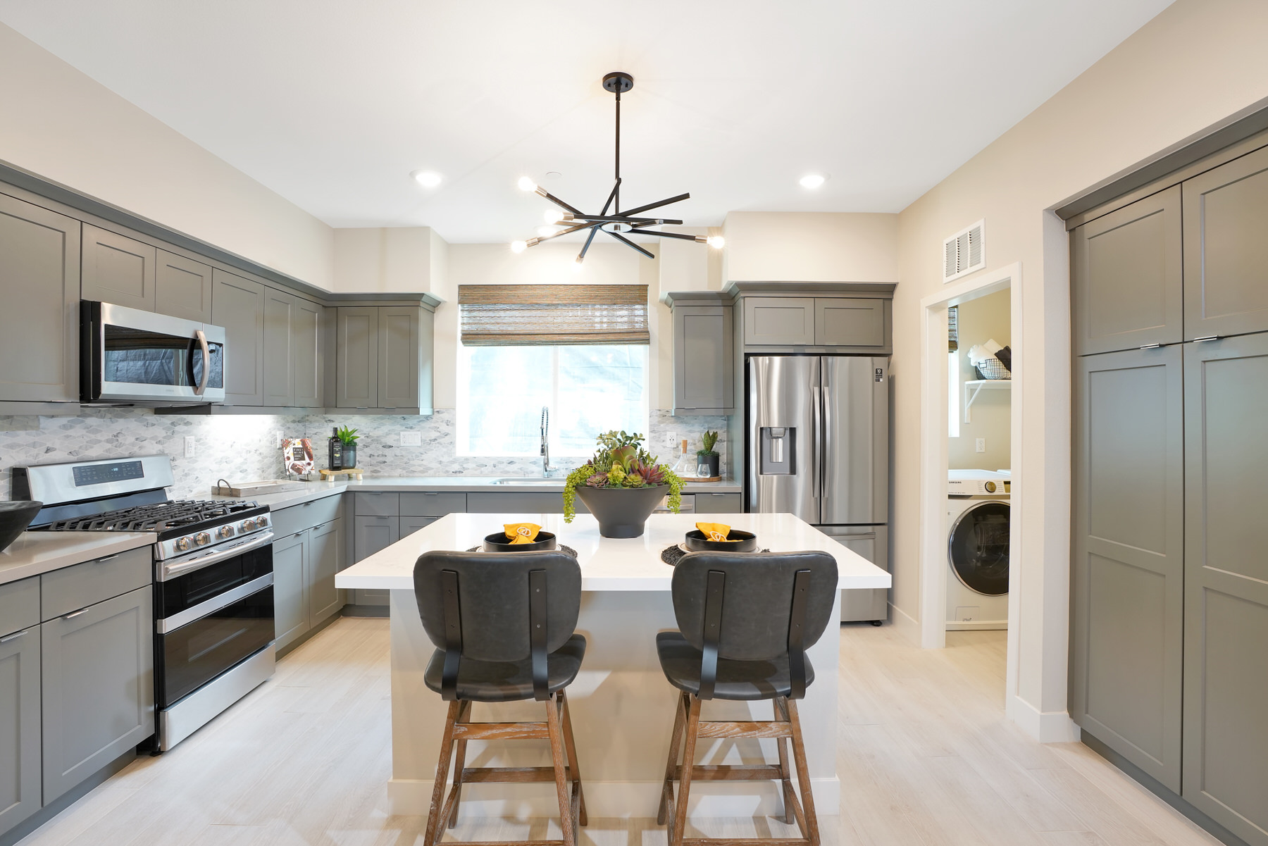 Kitchen/Laundry in Plan 3A at Townes at Magnolia by Melia Homes in Anaheim, CA