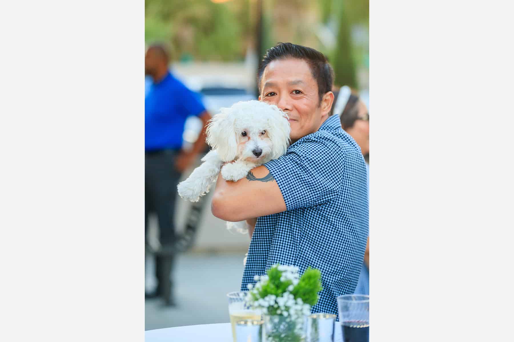 Man with his dog at Homeowner Happy Hour for Townes at Broadway and Townes at Magnolia by Melia Homes in Anaheim, CA