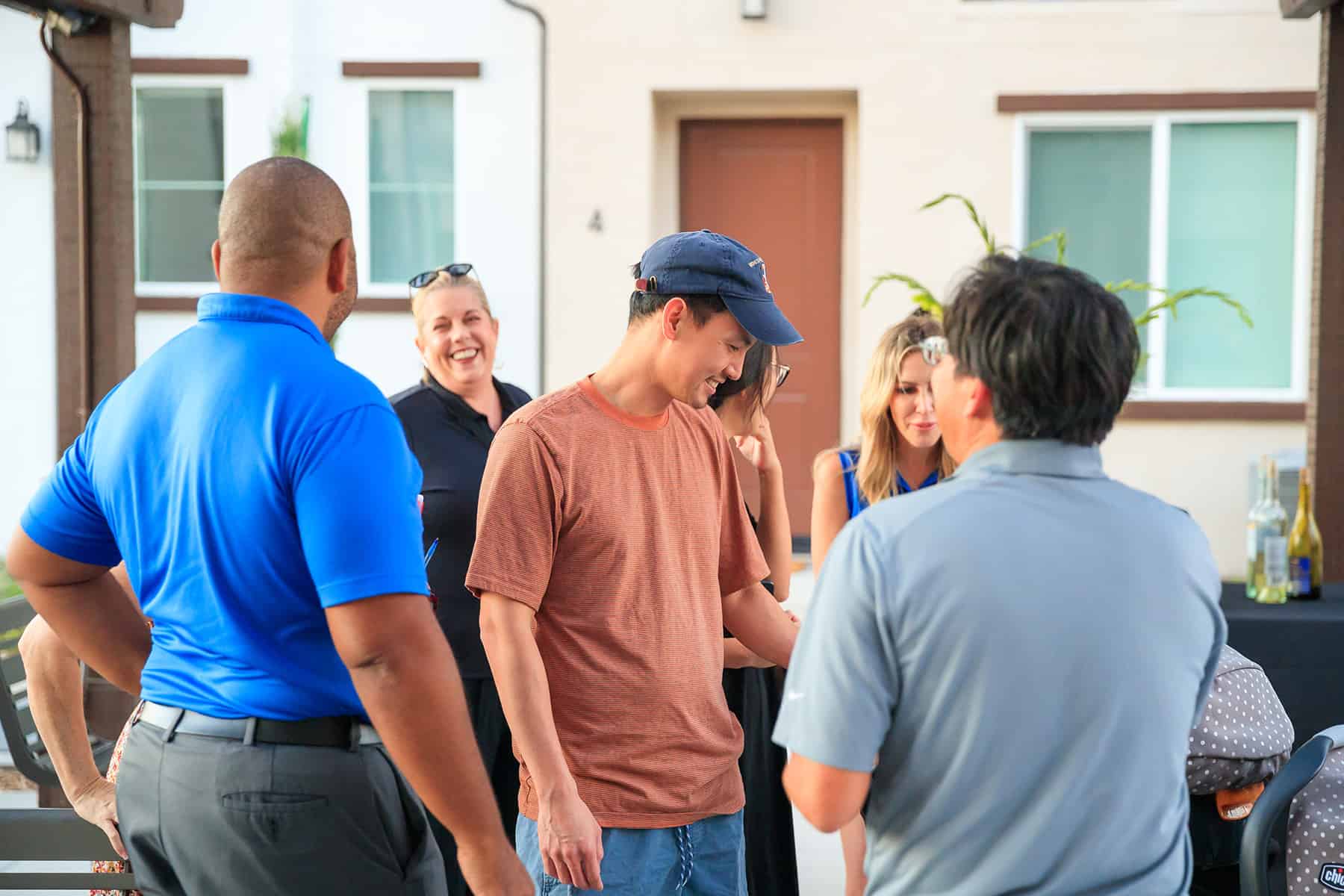 People socializing at Homeowner Happy Hour for Townes at Broadway and Townes at Magnolia by Melia Homes in Anaheim, CA